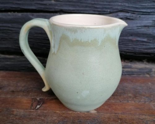 small light green ceramic pitcher